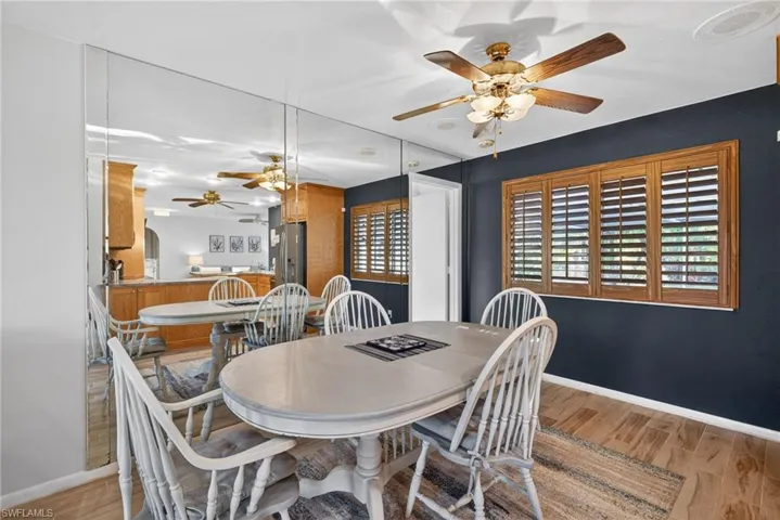 Dining room featuring light wood-style floors and a ceiling fan