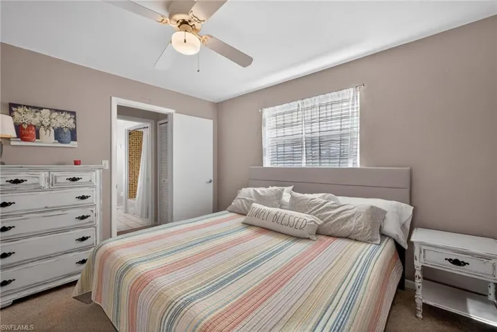 Bedroom with carpet flooring and ceiling fan