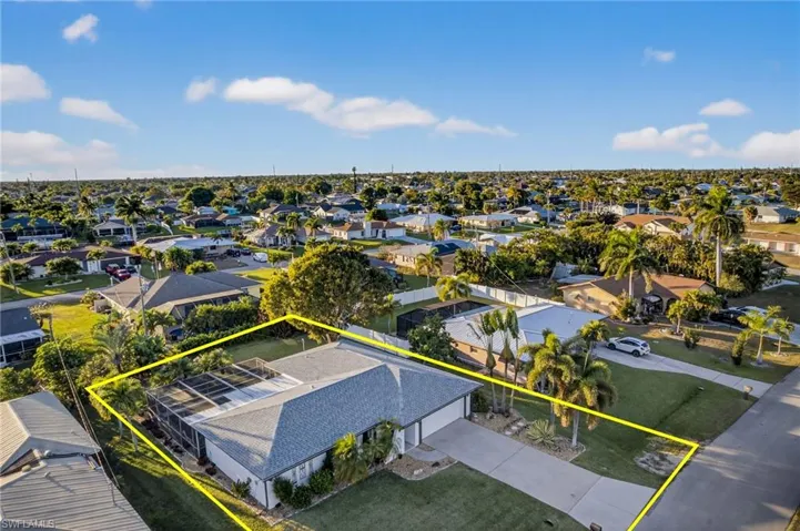 Aerial view of residential area with property parcel outlined
