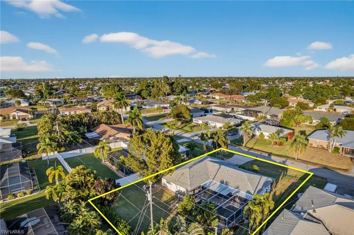 Aerial view of residential area with property boundaries highlighted