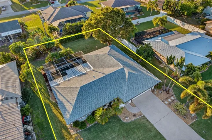 Aerial view of residential area with property boundaries highlighted