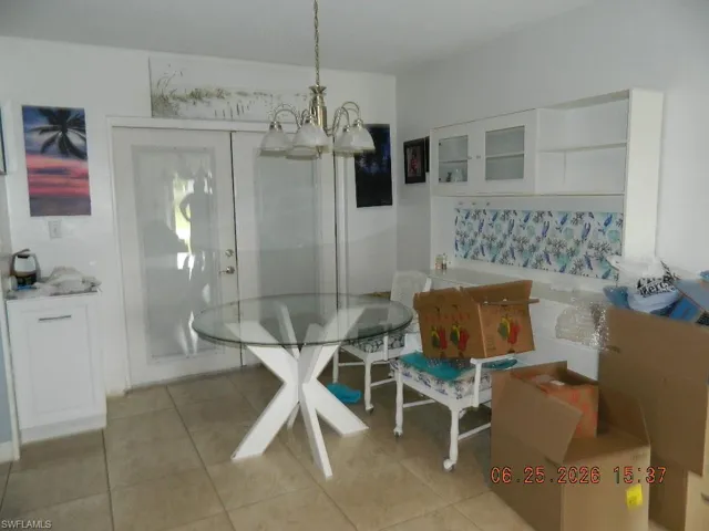 Tiled flooring complementing white cabinetry and a built-in bench seating area