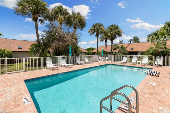 Community pool featuring a patio area