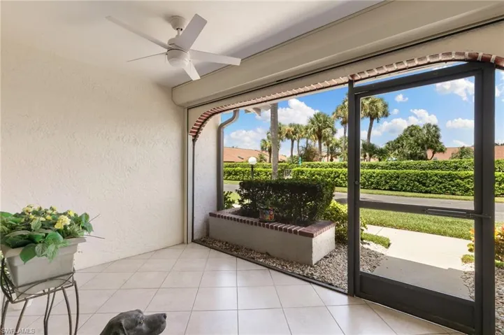 Unfurnished sunroom with ceiling fan