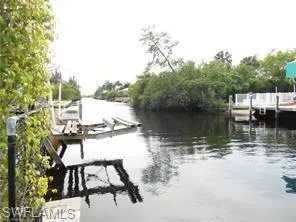 Dock area featuring a water view and boat lift