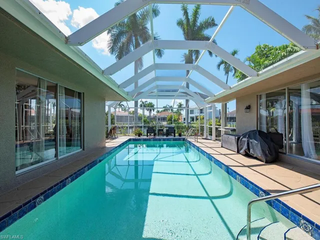 View of pool featuring a lanai