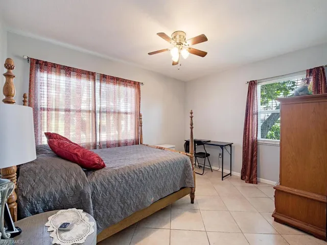 Tiled bedroom with ceiling fan