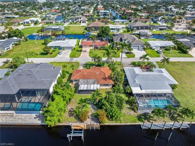 Aerial perspective of suburban area with a large body of water