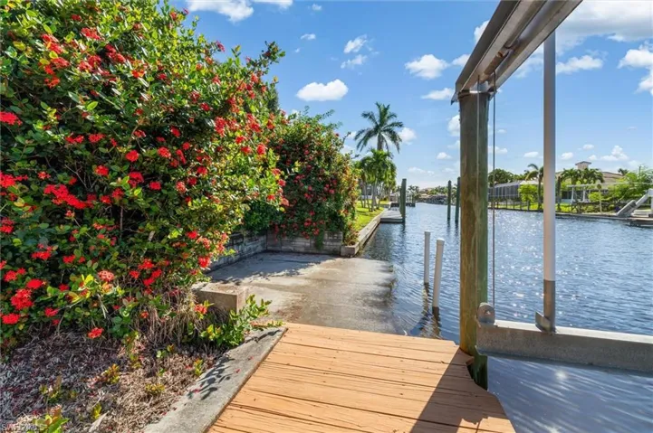 Dock area featuring a water view