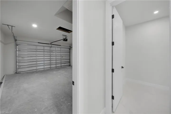 Garage featuring recessed lighting