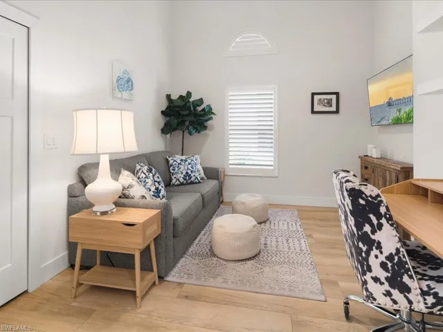 Living room with light wood-type flooring