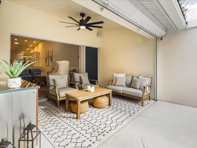 View of patio featuring an outdoor living space and ceiling fan