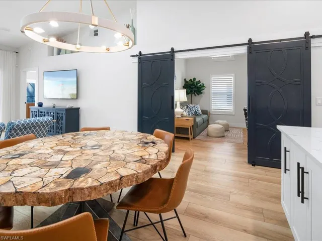 Dining area featuring a barn door and light hardwood / wood-style floors