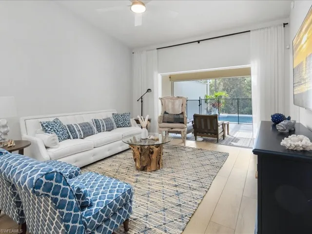 Living room featuring hardwood / wood-style floors and ceiling fan