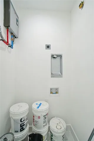 Half bath with toilet and baseboards