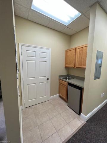 Unit 102 hallway to second rear office and entry to 4th office