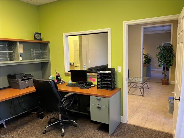Unit 101: possible waiting room with reception area behind sliding glass partition