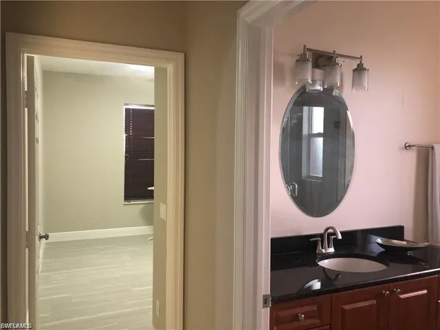 Bathroom with vanity and light wood-style flooring
