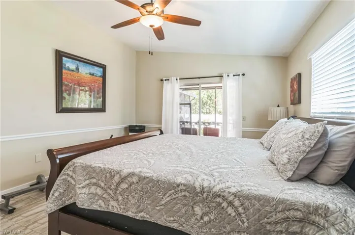 Bedroom featuring ceiling fan and vaulted ceiling