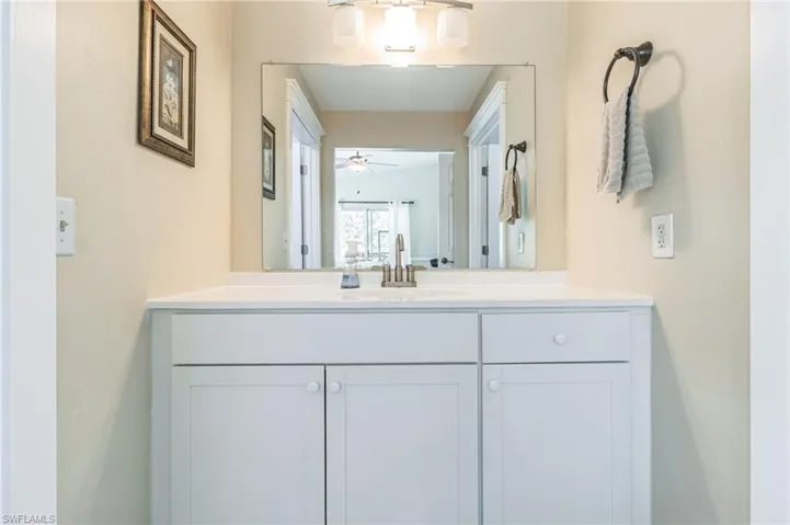 Bathroom with vanity and ceiling fan