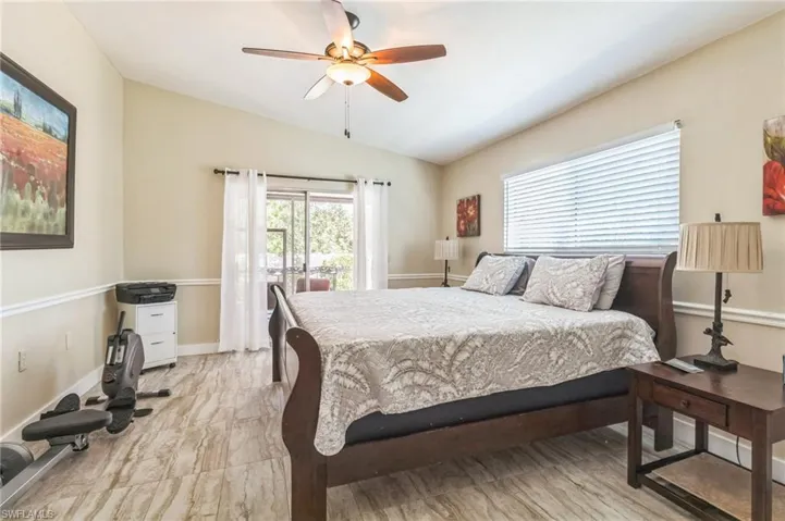 Bedroom featuring ceiling fan and vaulted ceiling