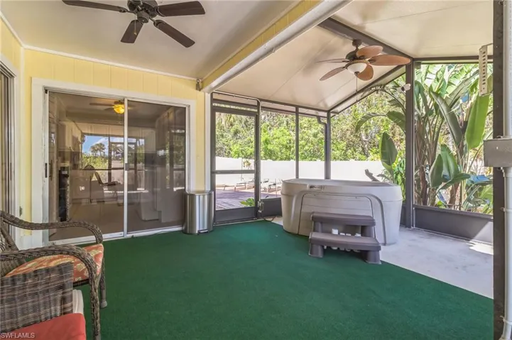 Unfurnished sunroom featuring lofted ceiling and a healthy amount of sunlight
