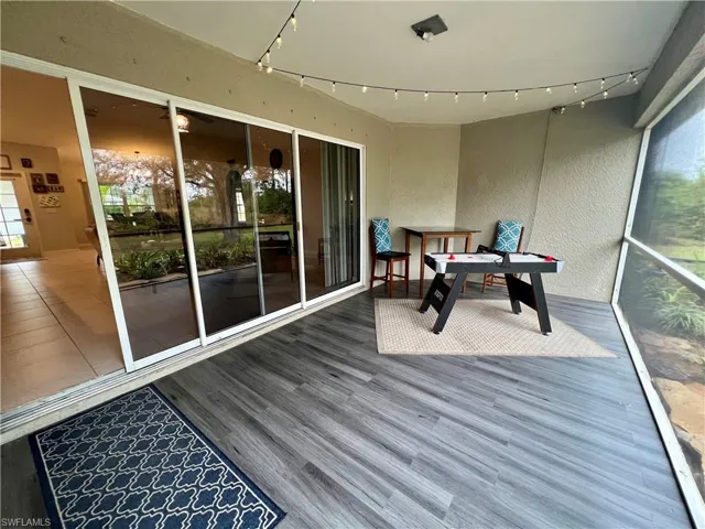 View of screened lanai with luxury vinyl plank floors.