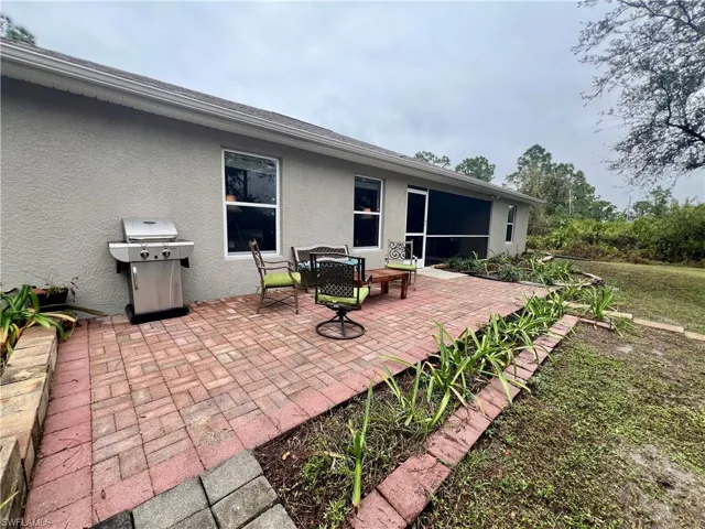 View of patio featuring area for grilling