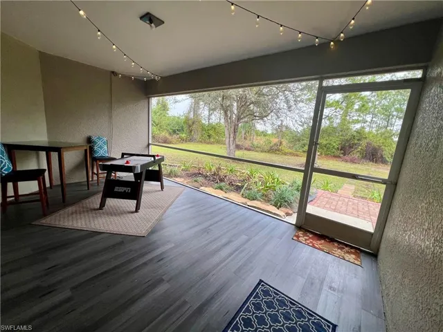 View of screened lanai with luxury vinyl plank floors.