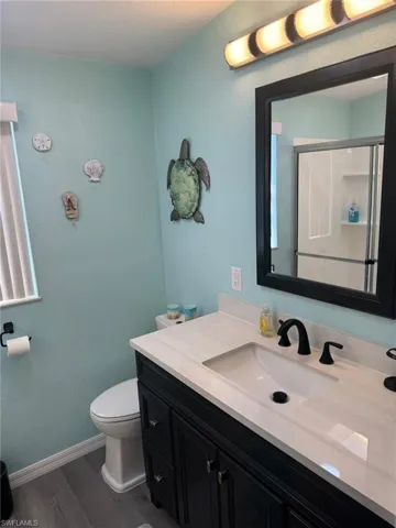 Both Bathrooms with new  vanities, new toilets, and walk in showers with glass doors