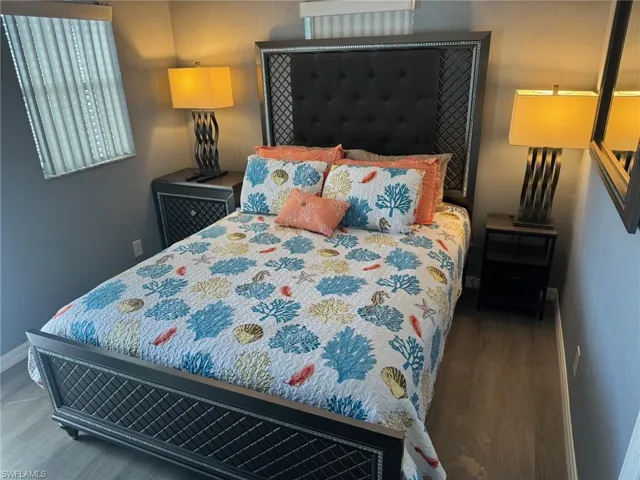 Bedroom with hardwood / wood-style floors