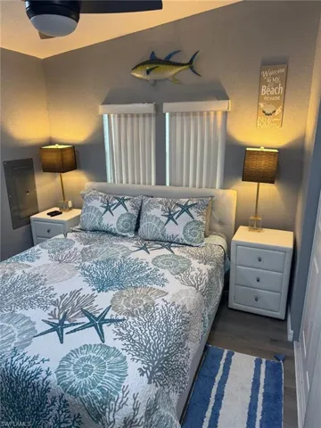 Bedroom featuring wood-type flooring and electric panel