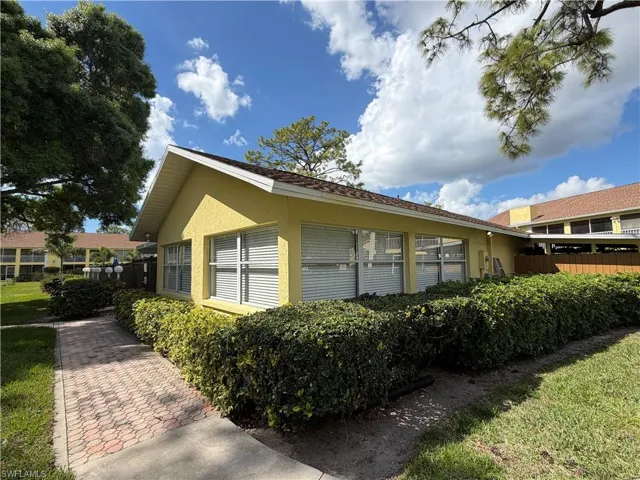 View of side of home featuring stucco siding
