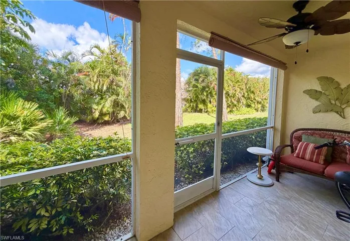 Sunroom / solarium with a ceiling fan
