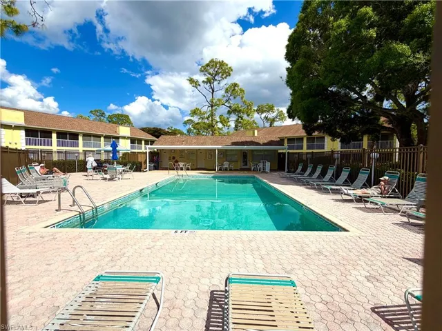 Community pool featuring a patio