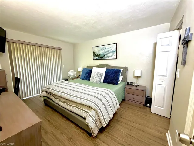 Bedroom with wood finished floors