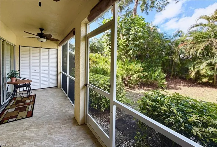 Sunroom / solarium with a ceiling fan
