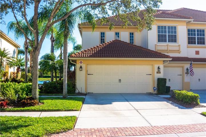 Front of Unit with wide driveway
