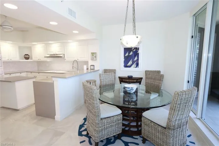 Dining area featuring recessed lighting