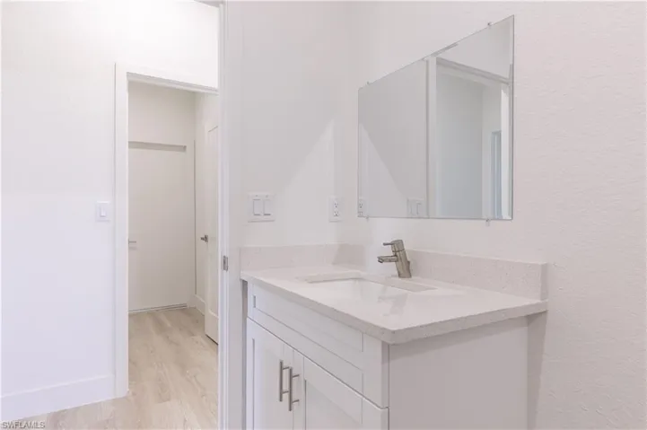 Bathroom featuring hardwood / wood-style floors and vanity