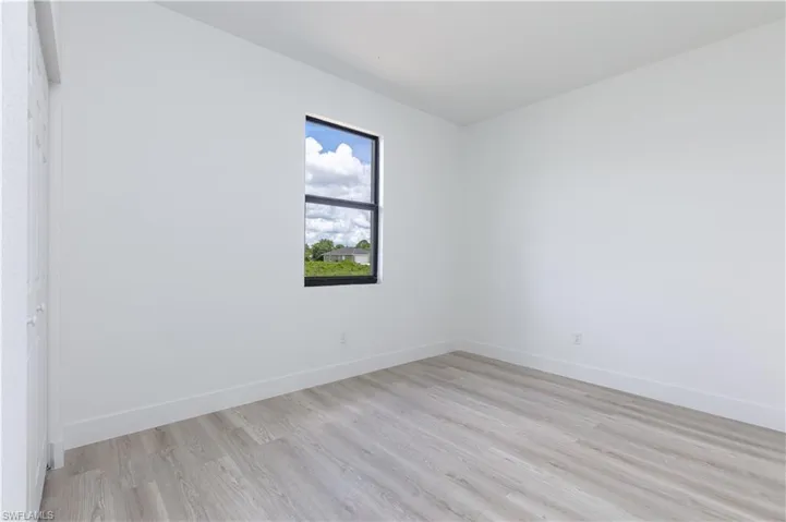 Empty room featuring light wood-type flooring