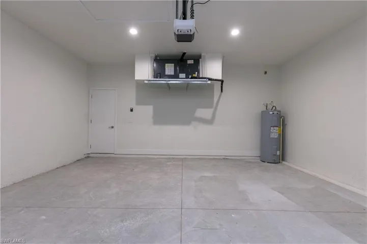 Garage with a garage door opener and water heater