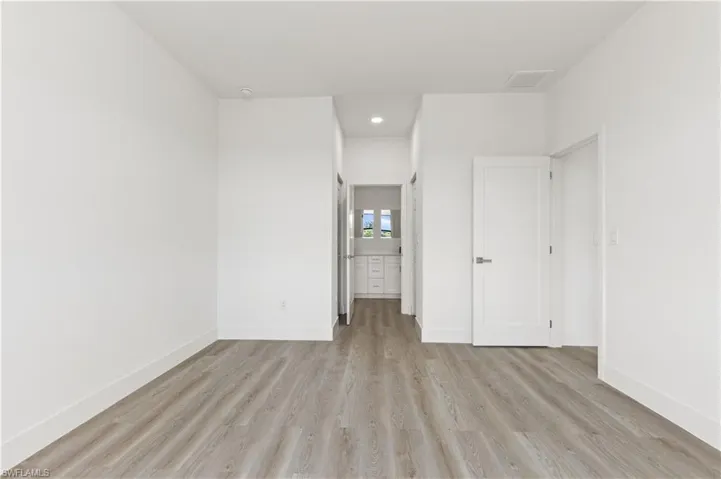 Unfurnished bedroom with light hardwood / wood-style floors