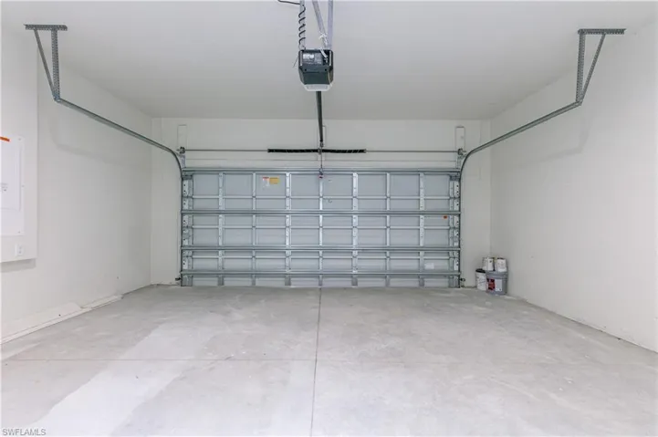 Garage featuring a garage door opener