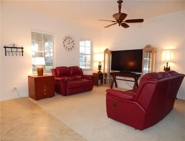 Tiled living room with ceiling fan