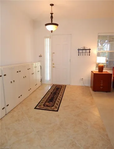 Foyer with tile floors