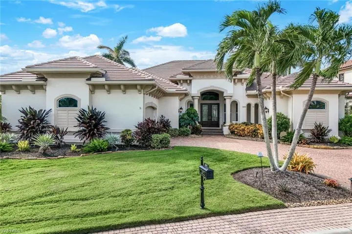 Mediterranean / spanish home featuring a front lawn