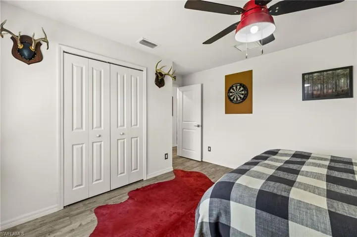 Guest bedroom with beautiful modern ceiling fan.