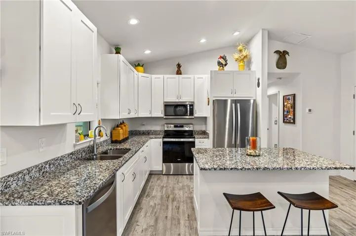 Kitchen has plenty of storage and also seating around the island.