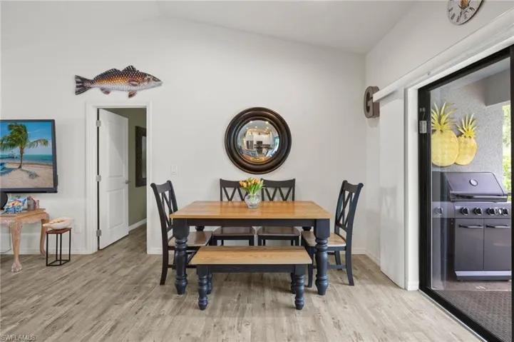 Ample dining space inside the house and out on the lanai.